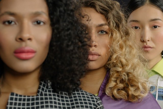 three woman with very different complexion